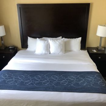 Comfort Suites Frisco - Our King size bed. This picture doesn't do the room justice. It was big and beautiful had a separate couch/eating/office area! - Hotels Near Me - Frisco, Texas