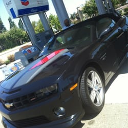 Gassing up the convertible Maro he named "Miranda" from Mass Effect! Smh! Lol