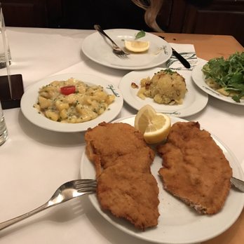 Figlmüller - Veal schnitzel, potato salad (left), browned potatoes (middle) and mixed salad (right) - Austrian Near Me - Vienna, 9 Figlmüller - Veal schnitzel, potato salad (left), browned potatoes (middle) and mixed salad (right) - Austrian Near Me - Vienna, 9