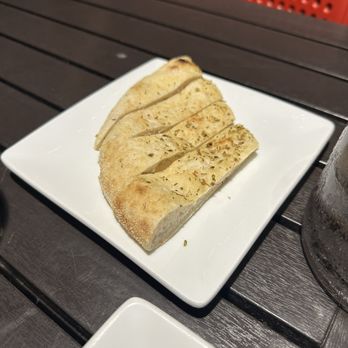 Kork Wine Bar - Focaccia bread is with the charcuterie platter - Wine Bars Near Me - Georgetown, Texas