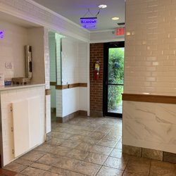 Not sure where the door goes, hallway to the left leads to the restrooms