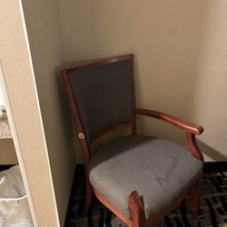 Rodeway Inn - Armchair with no arm and a bolt sticking out