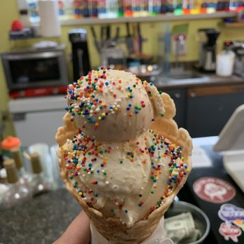 The Scoop - Tween Scoop- a large scoop with a small one on top Lemon cake and Peach Crumble with Rainbow Sprinkles in a housemade waffle cone - Ice Cream & Frozen Yogurt Near Me - Spokane, Washington
