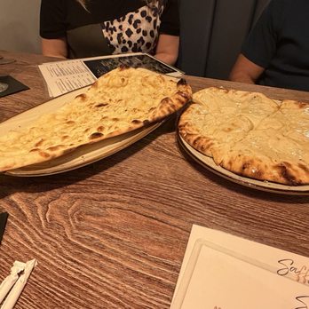 Saffron Kitchen and Bar - Garlic and cheese naan bread - Indian Near Me - Arlington, Texas Saffron Kitchen and Bar - Garlic and cheese naan bread - Indian Near Me - Arlington, Texas