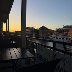 River City Wine - View of the balcony by the river at sunset.