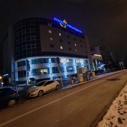Hotel Prezydencki - Outside of the hotel at night.