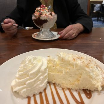 Fisherman's Crab Deck - Made in house Coconut Cream Pie & Whipped Cream (foreground). Hot Fudge Sunday (background). - Seafood Near Me - Grasonville, Maryland