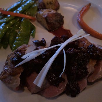 The West End Grill - Medium rare duck breast with sour cherries - American Near Me - Ann Arbor, Michigan The West End Grill - Medium rare duck breast with sour cherries - American Near Me - Ann Arbor, Michigan