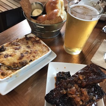 Cochon RESTAURANT - Ribs, dinner rolls and casserole of crawfish and green tomatoes - Cajun/Creole Near Me - New Orleans, Louisiana