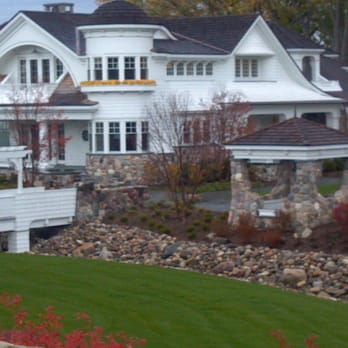 Constantine Irrigation - a large white house in a residential area - Landscaping Near Me - Nunica, Michigan Constantine Irrigation - a large white house in a residential area - Landscaping Near Me - Nunica, Michigan