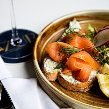 AZUR - a plate of food and a glass of wine - Tapas/Small Plates Near Me - Charleston, South Carolina