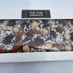 Custom chocolate bars. Mine was dark chocolate with coconut, cherries, almonds and hazelnuts. Yummy! Custom chocolate bars. Mine was dark chocolate with coconut, cherries, almonds and hazelnuts. Yummy!