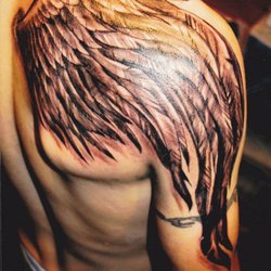 Pain Is Beauty Tattoo Studio