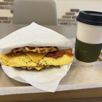 Awake Coffee - Bacon, egg, and cheese croffle with a medium, hot, caramel macchiato - Coffee & Tea Near Me - Suwanee, Georgia