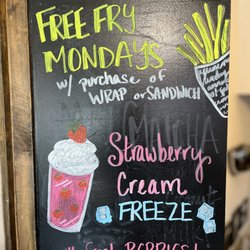 Hot Spot - "Free Fry Mondays" and "Strawberry Cream Freeze"  smoothies sign - Hot Spot