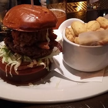Lucky Monk - 50/50 with my $2 upgrade to cheese curds.  The burger is on a platform, so it's deceiving, but it was good. - American Near Me - Barrington, Illinois