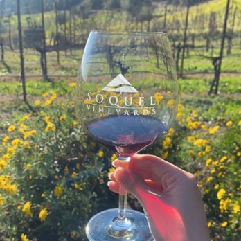 Soquel Vineyards - a hand holding a glass of wine - Wineries Near Me - Soquel, California Soquel Vineyards - a hand holding a glass of wine - Wineries Near Me - Soquel, California