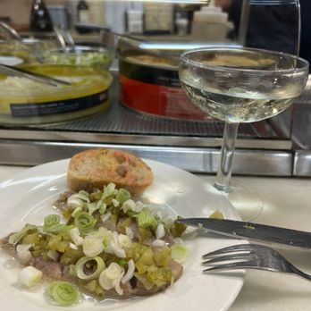 El Xampanyet - Sardine and green onions and a glass of house cava. - Tapas Bars Near Me - Barcelona, B El Xampanyet - Sardine and green onions and a glass of house cava. - Tapas Bars Near Me - Barcelona, B
