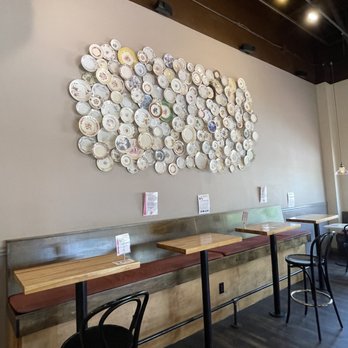 Buzz Bakeshop - Display of China plates on the wall - Coffee & Tea Near Me - Alexandria, Virginia