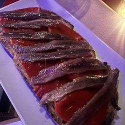 La Cueva de Lola - Tostada with anchovies and pimento pepper