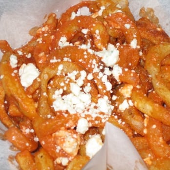 The Greasy Wiener - Buffalo Bleus - Curly fries topped with wing sauce and bleu cheese crumbles - Hot Dogs Near Me The Greasy Wiener - Buffalo Bleus - Curly fries topped with wing sauce and bleu cheese crumbles - Hot Dogs Near Me