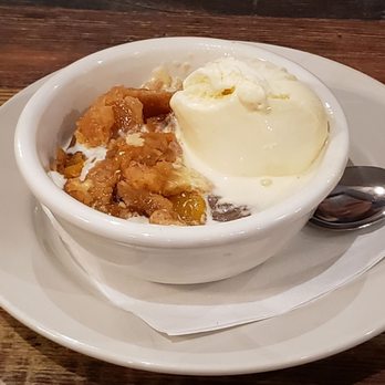Rafters Food & Spirits - The peach cobbler with vanilla ice cream. - Bars Near Me - Nashville, Indiana Rafters Food & Spirits - The peach cobbler with vanilla ice cream. - Bars Near Me - Nashville, Indiana