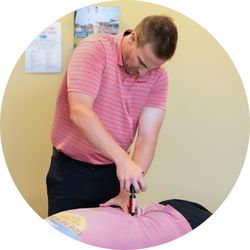 Greensboro Chiropractic - Dr. Gehrke adjusting with the Activator instrument