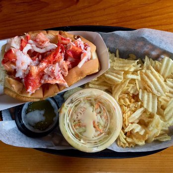 The Lobster Shack - A buttery lobster roll on a perfectly toasted bun, with a side of chips, cole slaw, and extra butter. - Seafood Near Me - Ogunquit, Maine The Lobster Shack - A buttery lobster roll on a perfectly toasted bun, with a side of chips, cole slaw, and extra butter. - Seafood Near Me - Ogunquit, Maine
