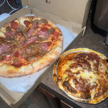 Cafe Corleone - Meat Lovers Pizza and Lasagna. Definitely recommend Lasagna if you're  a first timer. Crust is too big tho. - Italian Near Me - Paramount, California