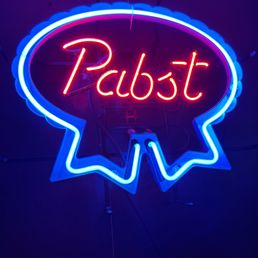 a neon sign that reads rabbitt a neon sign that reads rabbitt