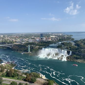 Skylon Tower - View of the American falls and the Rainbow bridge - Canadian (New) Near Me - Niagara Falls, Ontario Skylon Tower - View of the American falls and the Rainbow bridge - Canadian (New) Near Me - Niagara Falls, Ontario