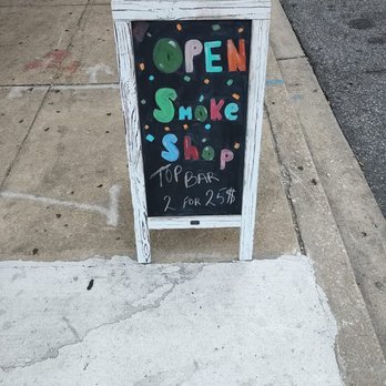 The Ultimate Shoppi - an open sign on the sidewalk - Tobacco Shops Near Me - Baltimore, Maryland The Ultimate Shoppi - an open sign on the sidewalk - Tobacco Shops Near Me - Baltimore, Maryland
