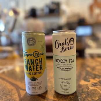 The Cup - two cans of coffee on a table - Coffee & Tea Near Me - Oceanside, California