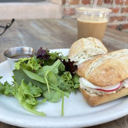 Tuna panino, salad with dressing on the side, and an iced espresso with almond syrup and a splash of soy milk. Tuna panino, salad with dressing on the side, and an iced espresso with almond syrup and a splash of soy milk.