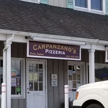 Carpanzano's Pizzeria - a delivery truck parked in front of a restaurant - Pizza Near Me - Guilford, Connecticut Carpanzano's Pizzeria - a delivery truck parked in front of a restaurant - Pizza Near Me - Guilford, Connecticut