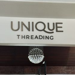 Unique Threading Salon & Spa - New sign inside.