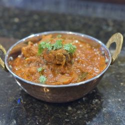 Taz Grill & Bar  - Chicken curry with bone  Served with rice