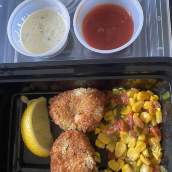 Ouisie's Table - Crab cakes with corn, tarter sauce and cocktail sauce - New American Near Me - Houston, Texas