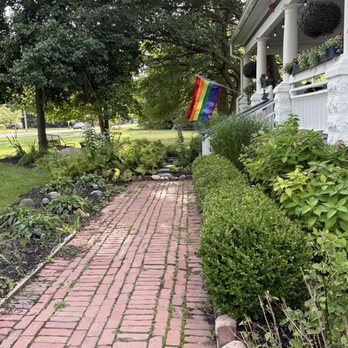 J. Paul's Dining Room - Front walkway and love the Pride flag! - New American Near Me - Douglas, Michigan