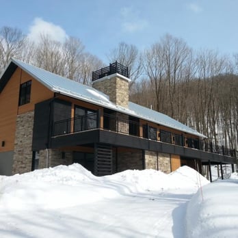 Constructions Guertin - a house in the snow - General Contractors Near Me - Shefford, Quebec