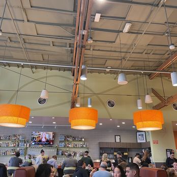 Snooze, an A.M. Eatery - Looking up from our table, used to be an old gas station, so high ceilings - Breakfast & Brunch Near Me - Orange, California