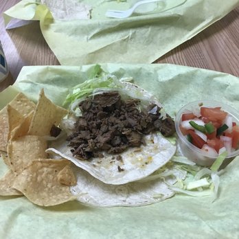 Fast Taco - a burrito and chips on a table - Mexican Near Me - Santa Monica, California