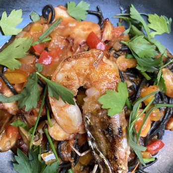 Spoon and Stable - Spaghetti Nero (half serving) -- squid ink pasta with prawns, octopus, mussels and sauce.  YUM, just YUM. - New American Near Me - Minneapolis, Minnesota