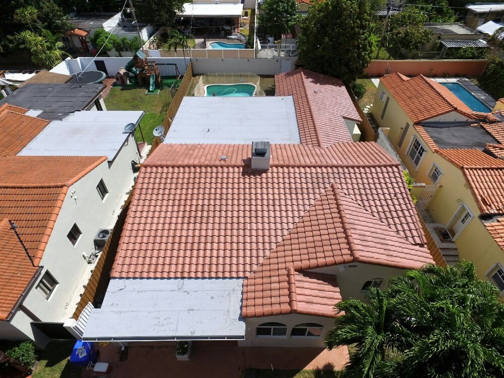 Slide of Caye Works Roofing