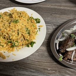 Chicken Biryani and 1 Piece Beef Lahori Seekh Kabab Chicken Biryani and 1 Piece Beef Lahori Seekh Kabab