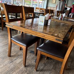 Tuscany Cafe - The owner manager in the black wit glasses talking casually with his customers. As the restaurant guy me very impressed x. J