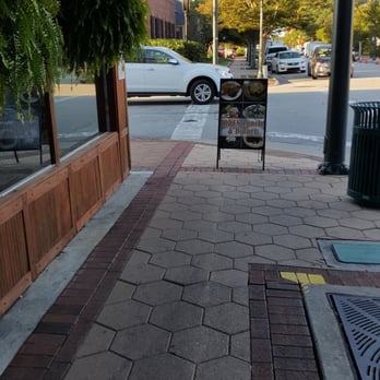 Captain Ratty's - How rude blocking the sidewalk and the handicapped curb Ramp with their sign. - Seafood Near Me - New Bern, North Carolina Captain Ratty's - How rude blocking the sidewalk and the handicapped curb Ramp with their sign. - Seafood Near Me - New Bern, North Carolina