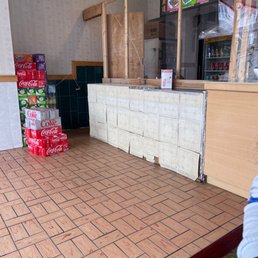a person standing in front of the counter a person standing in front of the counter