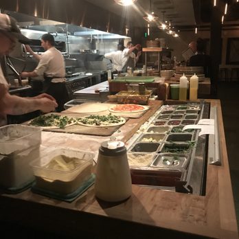 Basso - The kitchen whipping up my pizza and some other goodies. - Bars Near Me - Saint Louis, Missouri