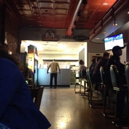 a man standing at the counter a man standing at the counter